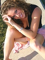 Jade posing in a long skirt outdoors