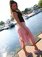 Jade posing in a long skirt outdoors