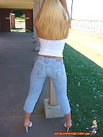 Kathy shows off her tight blue jeans outdoors