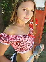 Brunette teen by the gas pump