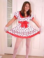Kara in a polkadot dress with white socks and stockings