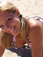 Beach teen squeezes her big boobies