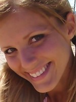 Beach teen squeezes her big boobies