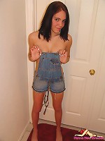 Hanna in sexy overalls in hallway