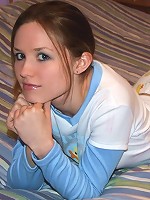 Kitty playing in bed