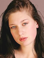 Beautiful brunette baring her slim body and posing sexy