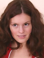 Sexy brunette girl bares her tight pussy and spreads