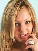 Extremely cute girl peels off her top and shows her round boobies