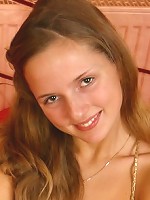 Lovely girl taking off her top and shows her cute teenie boobies