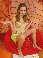 Lovely girl taking off her top and shows her cute teenie boobies