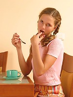 Pigtailed teen getting messy with jam