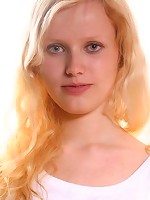 Adorable teenie takes off her white undies and exposes her pussy