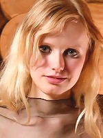 Cute skinny teen with no panties poses in fishnet top