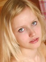 Adorable blond teen posing with no clothes on