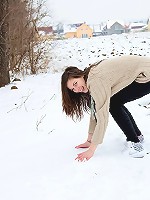 Large snowball throwing teenager