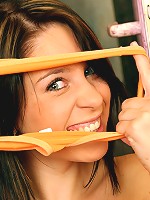 Teen biting down on a large dildo