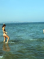 Girls fooling around on the beach