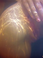 Two lesbian teens in a small pool