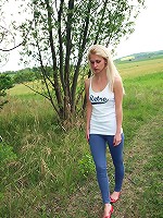 Teen petting herself in a forest