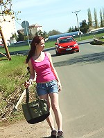 Daring teen strokes pussy outside