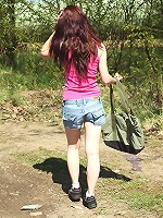 Daring teen strokes pussy outside