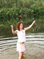 Chick washing herself in a river