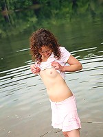 Chick washing herself in a river