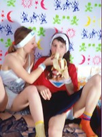 Girls playing with a long sex toy