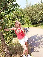 Chick stroking her snatch outside