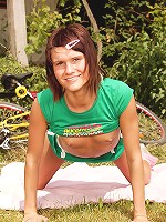 Teen brunette on a bike stopping