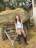 Cutie masturbating on a big farm