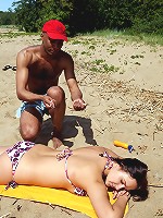 A cutie sucking cock on the beach