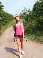 Strolling chick undresses outside