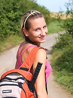 Strolling chick undresses outside