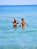 Two cute teen girls on the beach