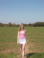 Cute teen strokes pussy outdoors