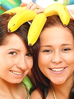 Teenie girls playing with bananas