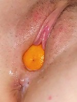 Teenager playing with a mandarine