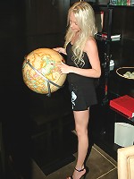 Hot little Kelly showing off her assets in a tight black dress.