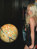 Hot little Kelly showing off her assets in a tight black dress.