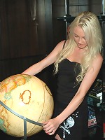 Hot little Kelly showing off her assets in a tight black dress.