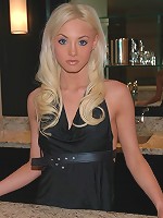 Kelly stands at the bar and strips off her dress.