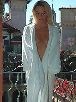 Kelly slides out of her white robe in public!