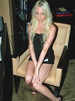 Hot little Kelly showing off her assets in a tight black dress.