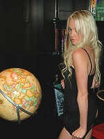 Hot little Kelly showing off her assets in a tight black dress.