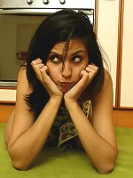 Girl gets naked and plays with her pussy in the kitchen