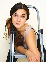 Sexy teen strips out and masturbates her wet pussy