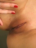 Enticing teen Leah toying a tight twat in the kitchen