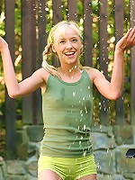 Cute teen gets soaking wet and rubs