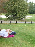 She is bent over and on the grass and she is taking cock in her sexy mature pussy